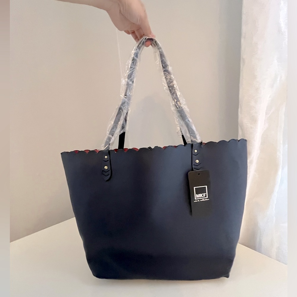 Brand new scalloped tote in navy blue/red vegan leather
